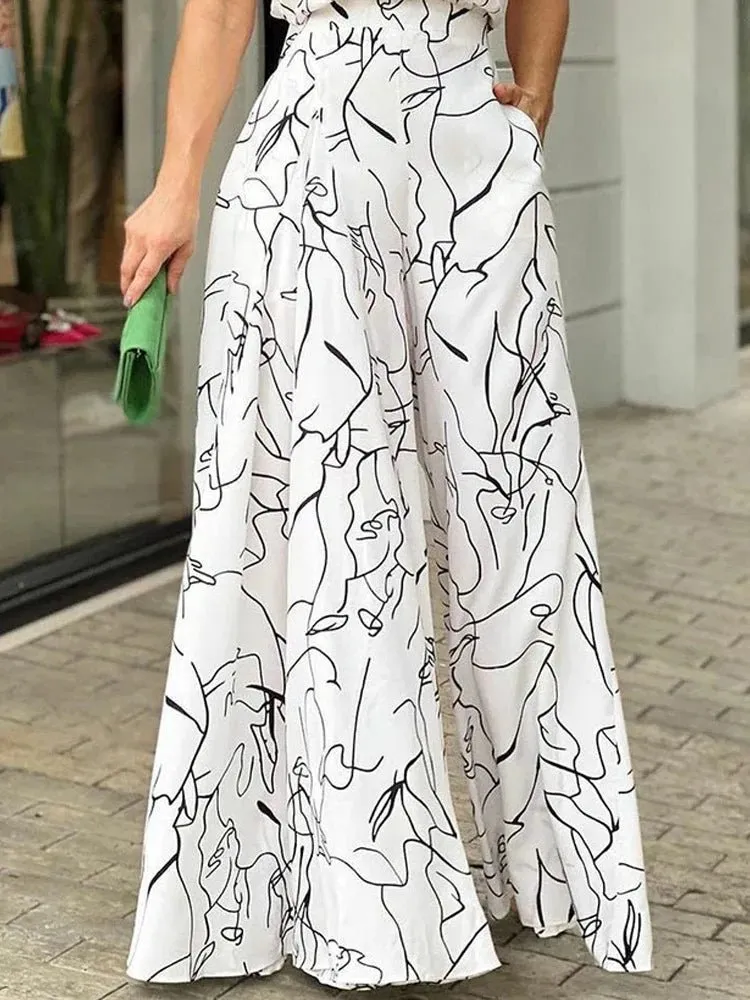 Elegant Halter Neck Jumpsuit: Casual Printed Design with Sleeveless Tie, Wide Leg Pants